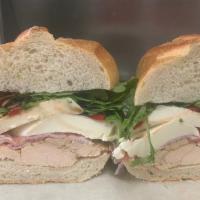 Pauly Walnuts Sandwich  · Grilled chicken, fresh mozzarella, roasted red peppers., prosciutto, mixed greens with balsa...