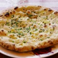 4. Onion Naan · Naan stuffed with fresh chopped onion. Freshly baked bread from tandoori clay oven.
