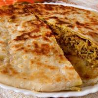 5. Cheese Naan · Naan stuffed with cheese. Freshly baked bread from tandoori clay oven.