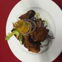 5. Lamb Boti Kabab · Juicy pieces of marinated lamb roasted in clay oven. Served with basmati rice.