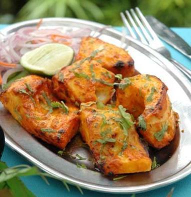 9. Salmon Fish Tandoori · Marinated in yogurt and spices, roasted in clay oven. Served with basmati rice.
