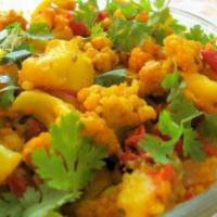 16. Gobi Bhaji · Cooked with cauliflower, tomatoes and onion. Served with basmati rice.