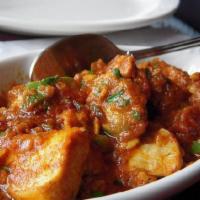 7. Chicken Rogan Josh · Cooked with house blended cardamon sauce. Served with basmati rice.