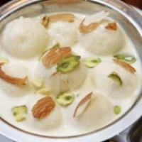 Rasmalai · Soft patties of homemade cheese poached in condensed milk sauce.