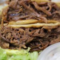 Pulled Beef Tacos (3 pc) · Hard taco shells stuffed with pulled beef