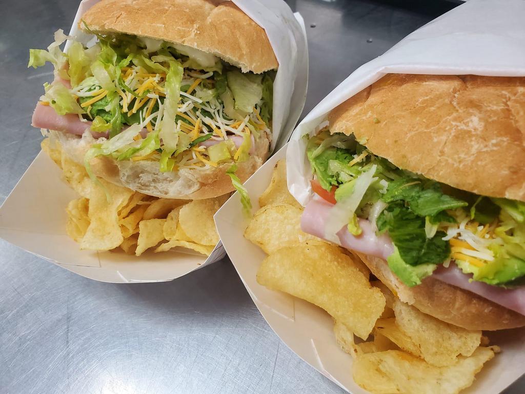 Tortas · Sandwich made with lean ham, avocado, serrano peppers, tomatoes, mustard and mayo; with chips on the side.
Sandwish made with pork carnitas avocados, tomatoes ,lettuce and mayonaise.