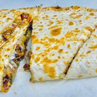 Chicken Quesadillas · Cooked tortilla that is filled with cheese and folded in half. 