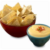 Queso + Chips · Crispy tortilla chips served with gooey, cheesy, queso!