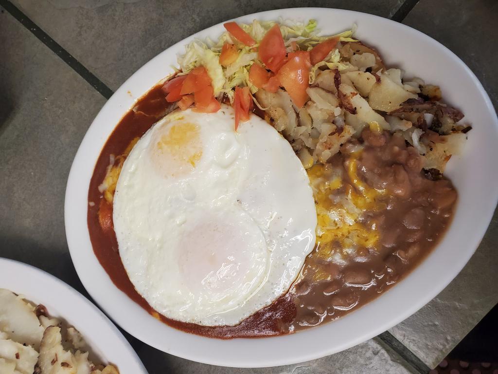 Enchiladas & Eggs · 2 eggs any style, red or green chile, beans and potatoes. Flour tortilla on side.
