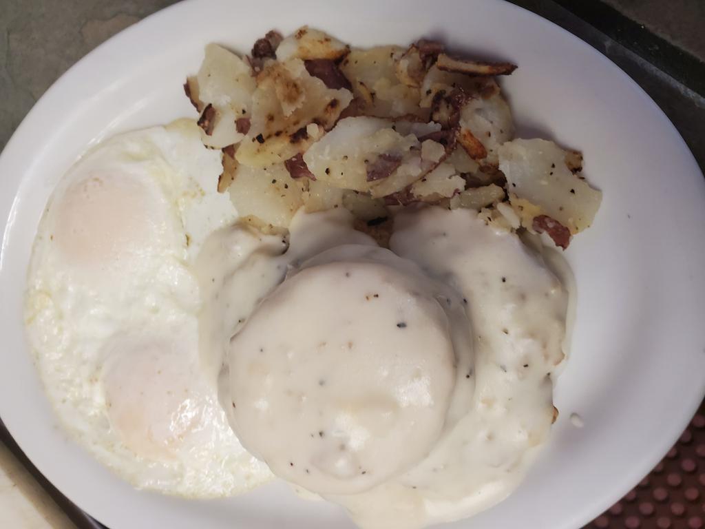 Chicken Fried Steak and Eggs · CFS with white gravy & a biscuit on top. Served with homefied potatoes and toast.