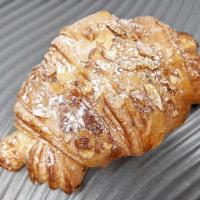 Almond Croissant · Butter Layers with toasted almonds and an almond paste center