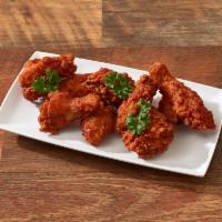 Chicken Wings · Spicy breaded wings served with a side of ranch dressing. 