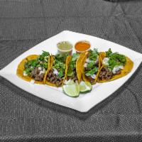 Tacos de Carne Asada (street tacos) · 5 mini tacos de maiz con carne asada cilantro y cebollachicas. 
5 mini corn tortillas. Serve...