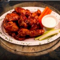 6 Pieces Chicken Wings · Cooked wing of a chicken coated in sauce or seasoning.