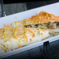 Beef Quesadilla · Cooked tortilla that is filled with cheese and folded in half. 