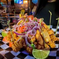 Peruvian Jalea · Combination of fried seafood including shrimp, calamari, and tilapia fish. Served with yucca...