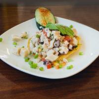 Ceviche Mixto · shrimp and fish ceviche served with tostada and chips.