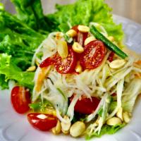 Papaya Salad · Spicy shredded green papaya with chili, fresh garlic, shredded carrot, tomato, green bean, g...