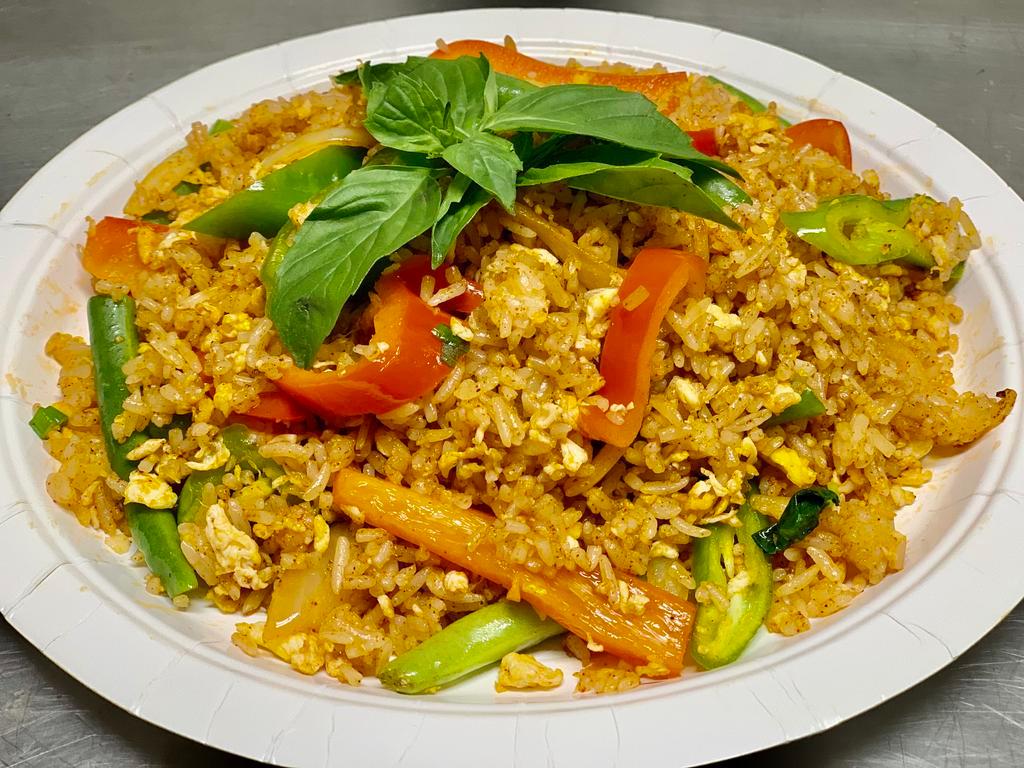 Basil Fried Rice · Spicy flavorful fried rice from steamed jasmine rice, egg, chili paste, green beans, onion, bell pepper and fresh basil. Mild.