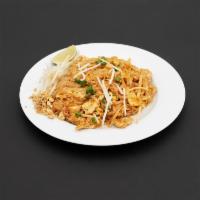 Pad Thai · Thailand most famous stir-fried rice noodles: egg, green onions, bean sprouts and crush pean...