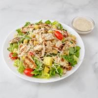 Grilled Chicken Caesar Salad · Grilled chicken over classic Caesar salad with cherry tomatoes, shaved Romano and homemade c...