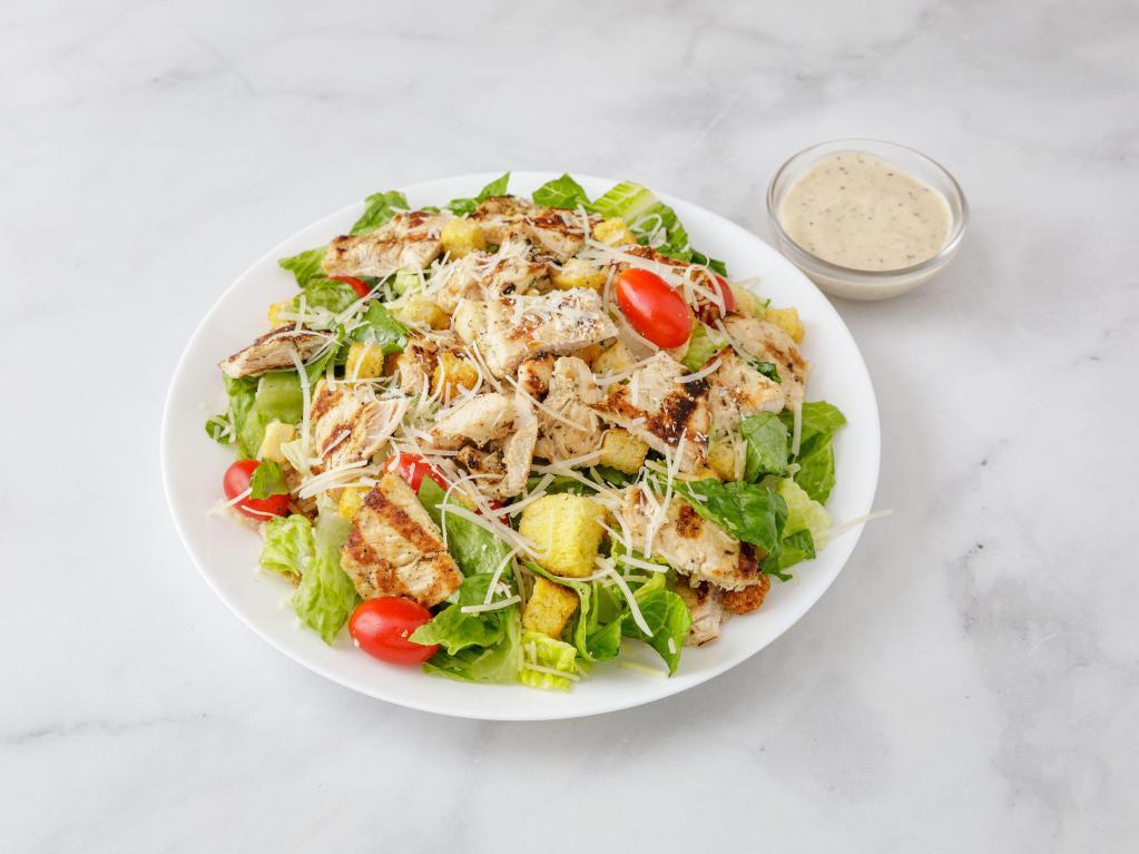 Grilled Chicken Caesar Salad · Grilled chicken over classic Caesar salad with cherry tomatoes, shaved Romano and homemade croutons over romaine. 
