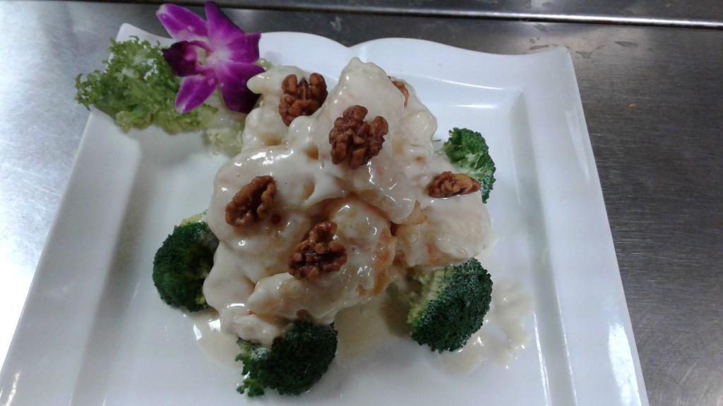 Grand Marnier Prawns · Shrimp with honey walnut creamy sauce and broccoli.