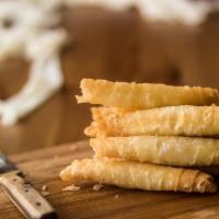 Crispy Phyllo Rolls · Lightly fried crispy pastries stuffed with feta cheese & parsley