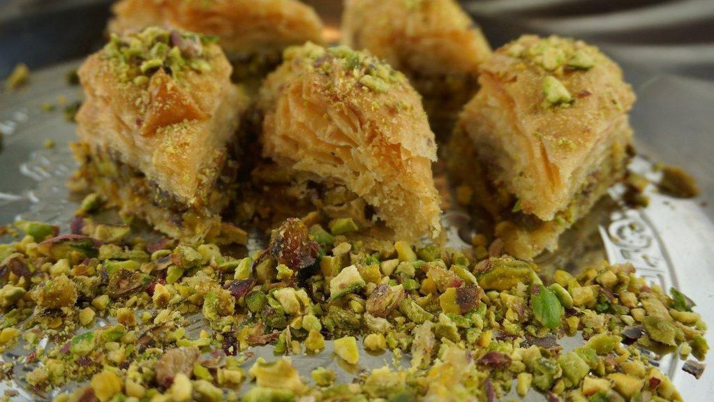 Pistachio Baklava (4 PC) · Layered pastry dessert made of filo pastry, filled with chopped Pistachio, and sweetened with honey.