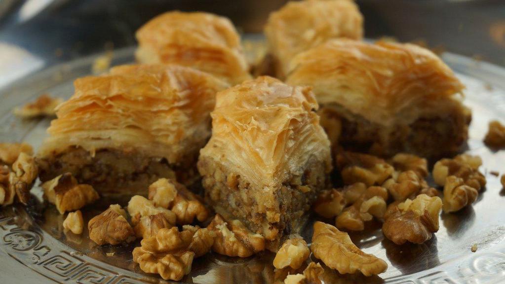 Walnut Baklava (4PC) · Layered pastry dessert made of filo pastry, filled with chopped walnuts and sweetened with honey.