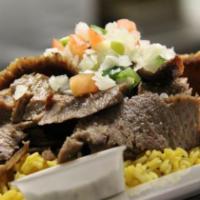 76. Lamb Gyro · Layer of marinated ground meat, wrapped around the large vertical
spit and grilled in front ...