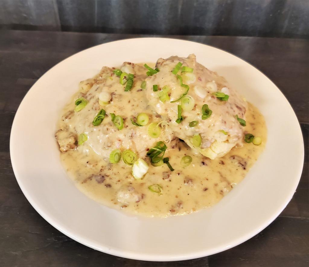 Biscuits with Bacon Sausage Gravy Breakfast · 2 of our fluffy house-made buttermilk biscuits smothered with our creamy sausage and bacon gravy, topped with green onions.