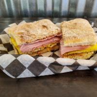 Ciabatta Breakfast Sandwich · A toasted house-made ciabatta roll, buttered, then layered with eggs, and your choice of sau...
