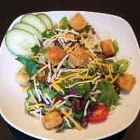 House Salad · Spring mix greens, tomatoes, onions, cucumbers, mixed cheese and croutons with your choice o...