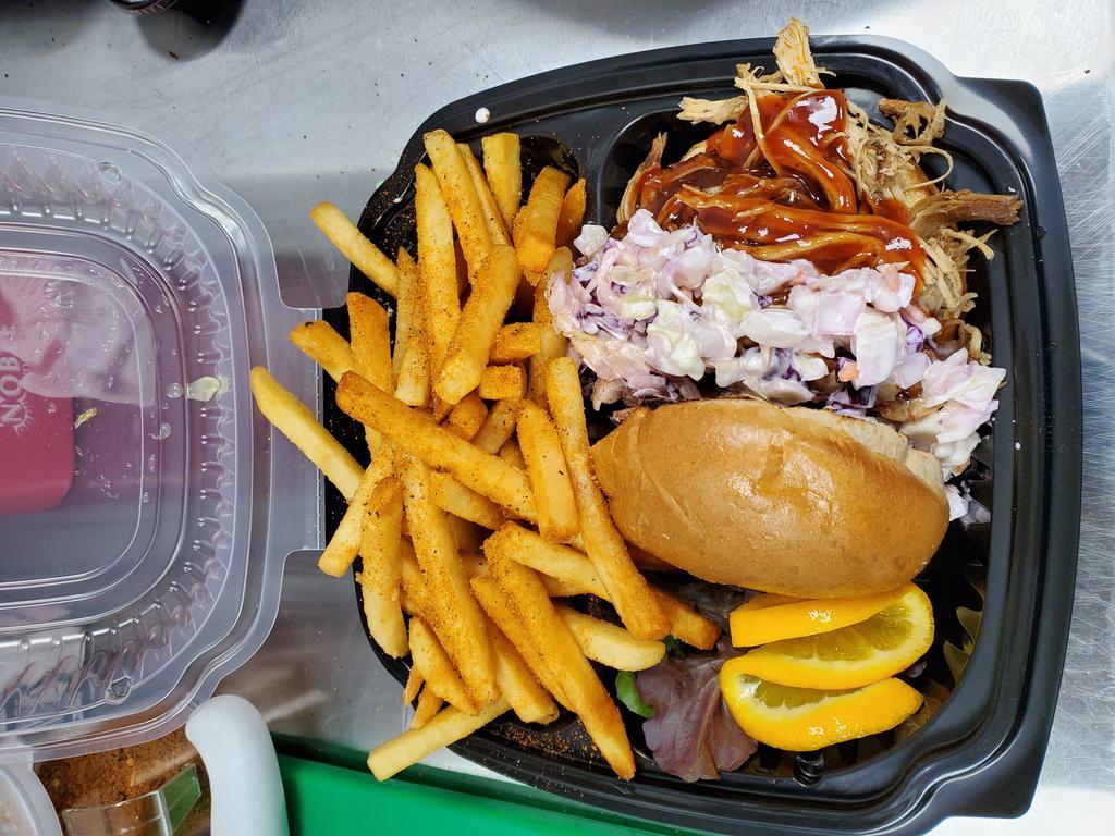 Pulled Chicken Sandwich with French Fries · Smoked pulled chicken seasoned with our house blend of spices served on a toasted brioche bun and topped with homemade coleslaw and BBQ sauce. Can also be served without bread if preferred.