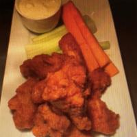 Buffalo Chicken Wings  · Carrots, celery, and blue cheese.