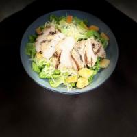 Grilled Chicken Caesar Salad · Chopped romaine, grilled chicken, house-made croutons, and creamy Caesar dressing.