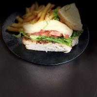 Turkey Club Sandwich · Smoked turkey breast, thick cut bacon, lettuce, tomato, and mayo.