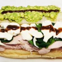 15. Turkey Avocado Sub · Roasted turkey, fresh mozzarella, spinach, avocado spread and homemade balsamic vinaigrette.