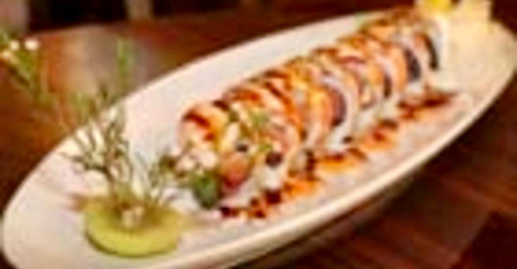 Akimoto Sushi Special Roll · Tuna, salmon, yellowtail, asparagus wrapped with seared salmon, tuna, yellowtail and eel sauce with mayo.