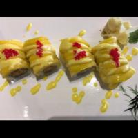 Mango Mania Roll · Crunchy, spicy snow crab roll topped with fresh mango and mango sauce.