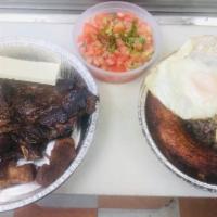 149. Typical Plate (Plato tipico) · Includes- Fried Eggs, Grilled Steak, Chimol, Casamiento (rice), Fried Pork, and Fried Planta...