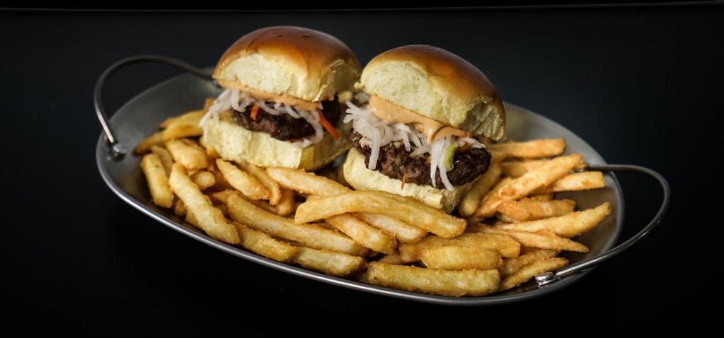 Bulgogi Sliders · 2 sliders
bulgogi patties topped with house made pickled radish and chipotle sauce on toasted brioche

*freshly fried fries included
