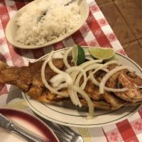 Broiled Red Snapper · Comes with white rice and black beans.