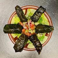 Stuffed Grape Leaves · Grape leaves stuffed with tantalizing mix of rice, fresh parsley and plum tomato. Vegetarian. 