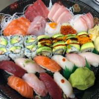 Love Boat For 2 · 8 Pcs Sushi, 18 Pcs Sashimi, 1 Dragon Roll, and 1 Tuna roll. Assorted Sushi & Assorted Sashi...