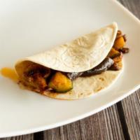 Veggie Taco · Mushrooms, zucchini, squash, eggplant, sliced onions, and queso Blanco perfectly seasoned in...