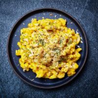 Truffle Mac and Cheese · Macaroni prepared with freshly made cheese sauce, bearnaise and white truffle.