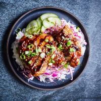 BBQ Chicken Rice Bowl · Marinated chicken bbq with pickled cucumbers, cabbage, sesame seeds, rice
