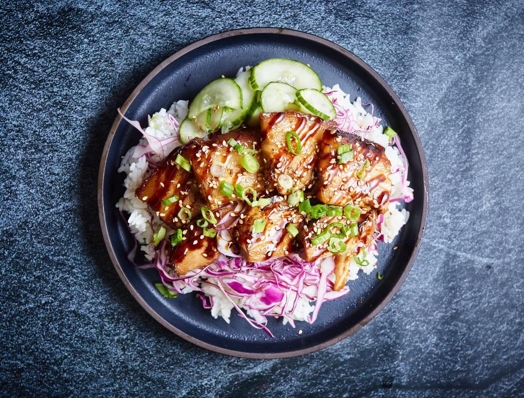 Original Pork Belly Bowl · Thinly sliced decadent braised pork belly with pickled cucumbers, cabbage, sesame seeds, and rice